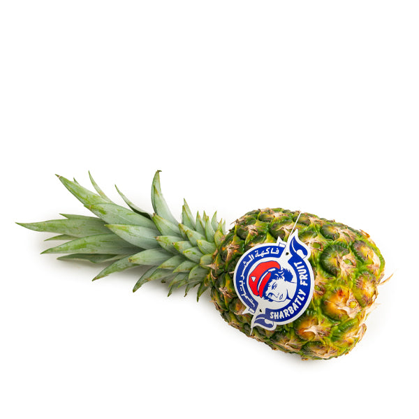 Golden pineapple from Sharbatly, single ripe fruit with spiky green leaves and bright yellow flesh, fresh and ready to enjoy.