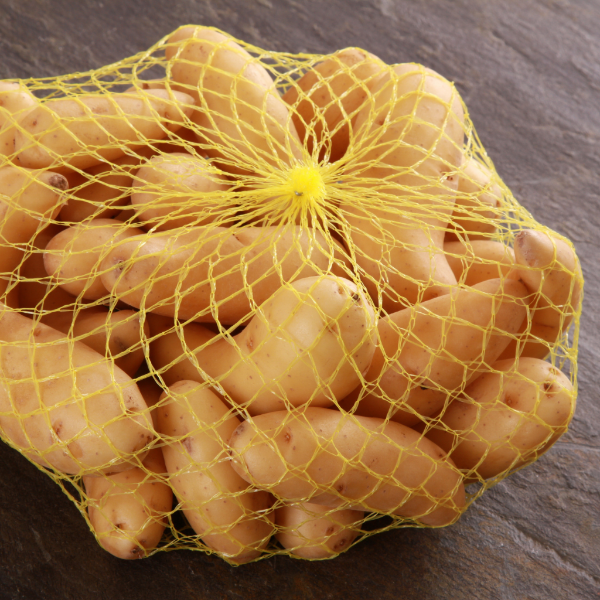 Holland La Ratte potatoes in a 1 kg pack, small fingerling vegetable potatoes with smooth, thin skin and elongated shape.