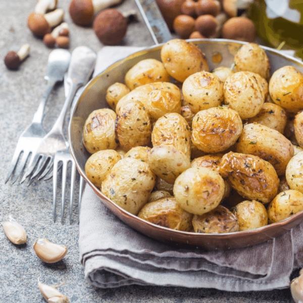 Fresh baby potatoes from USA, 1 kg pack, showing small, smooth, round vegetables ideal for cooking or snacking.
