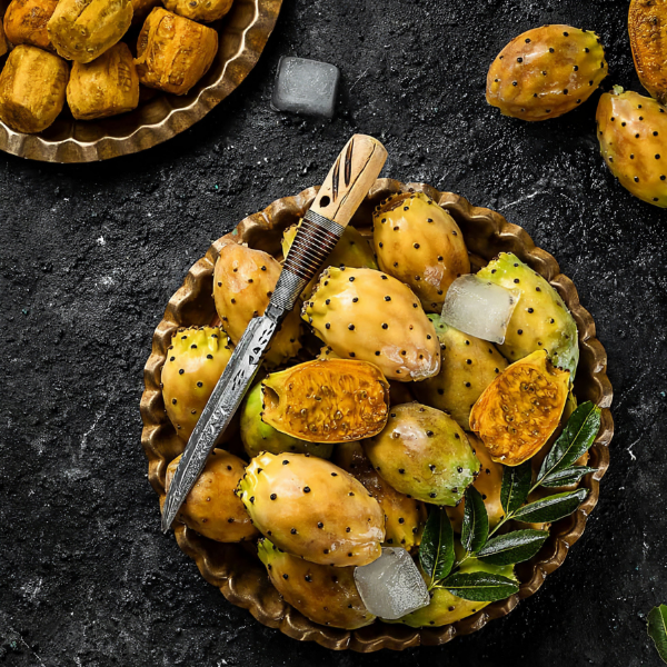 Fresh prickly pears from local market, showcasing cactus pears in a 1 kg pack, with their spiky green exterior and vibrant interior.