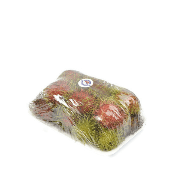Fresh rambutans from Thailand in a 0.5 kg pack, showing their spiky red exterior and leafy green tips.