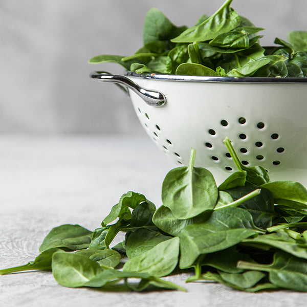 Fresh baby spinach from Holland in a 0.125 kg pack, showcasing vibrant green, tender leaves ideal for salads and cooking.