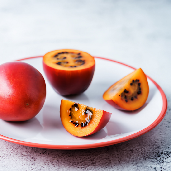 Holland Tamarillo red fruit in a 0.5 kg pack, showing vibrant red skin and fresh appearance.