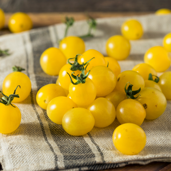 Yellow cherry tomatoes from Sharbatly in a 0.25 kg pack, fresh and ripe, perfect for salads and snacking.