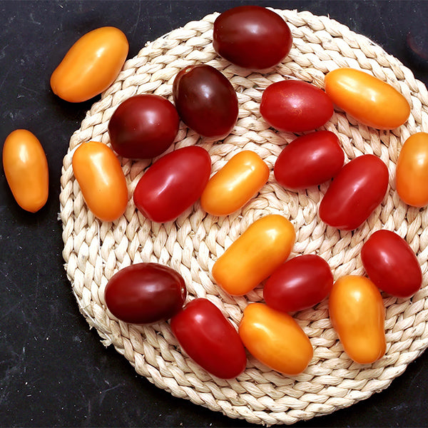 Colorful mix of cherry and plum tomatoes from Sharbatly, fresh vegetables in 0.25 kg bundle, vibrant and ripe for salads or cooking.