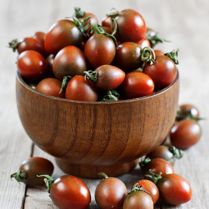 Black cherry tomatoes in a 0.25 kg pack, fresh Holland vegetables with vibrant, glossy black cherry tomatoes.