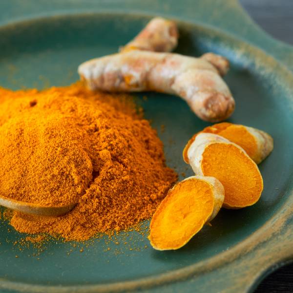 Fresh turmeric vegetable from Local Market, showing vibrant orange roots and fibrous texture in a 0.250 kg pack.