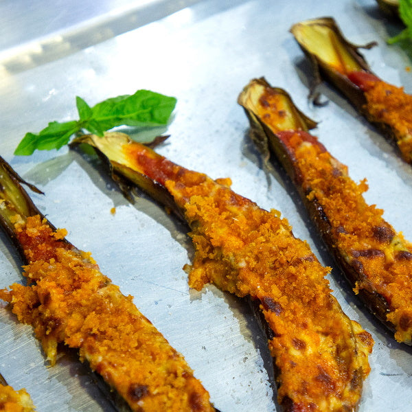 Fresh baby long eggplant from Local Market, 0.5 kg, showing vibrant purple skin and smooth elongated shape.