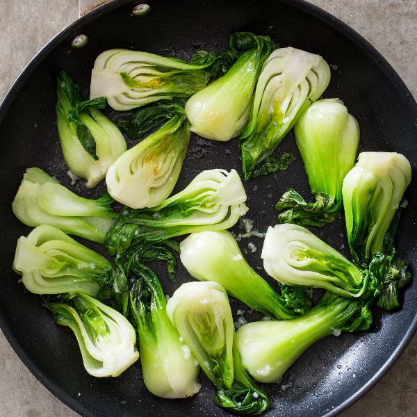 Fresh Paksoy baby Thai vegetable in a 0.5 kg pack, showcasing vibrant green Pakchoi leaves and stalks.