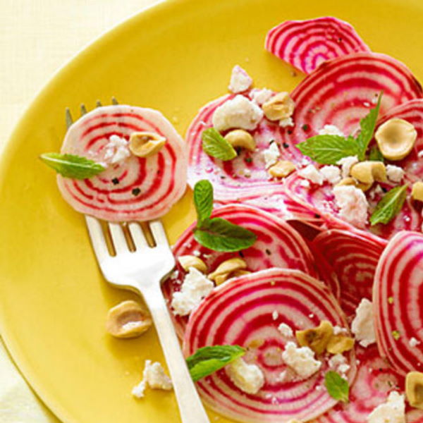 Fresh Holland Beetroots Chioggia, 1 kg pack, featuring vibrant striped red and white vegetable roots on a rustic background.
