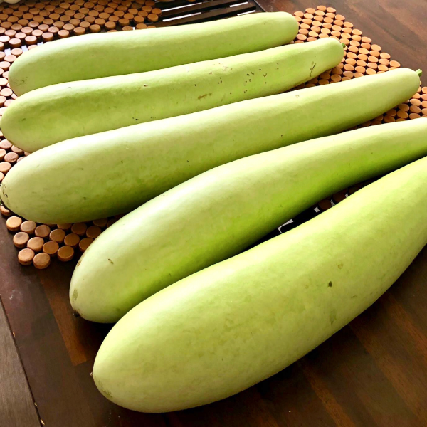 Fresh bottle gourd, calabash, and cucuzza squash in a 2 kg pack from Local Market, showcasing their green, smooth surface and size.