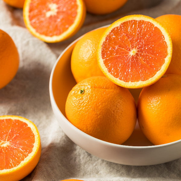 Fresh blood oranges from USA, 1 kg pack, showcasing vibrant orange skin and juicy interior, perfect for healthy snacking.