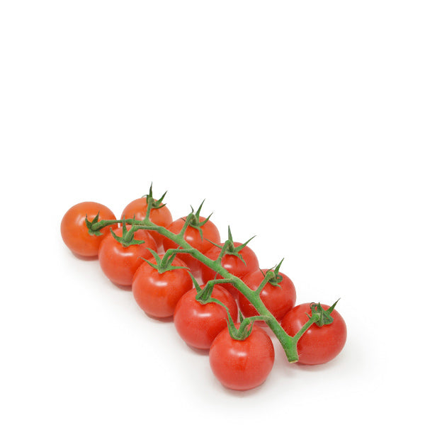 Fresh red cherry tomatoes on the vine, hydroponically grown by Dava Farm, displayed in a cluster with green stems.