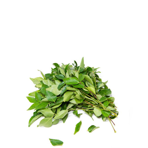 Fresh curry leaves bunch from local market, vibrant green herb for cooking, approximately 0.05 kg.