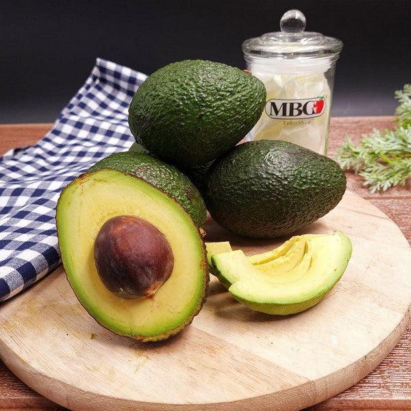 Fresh Hass avocados from Sharbatly in a 3.8 kg carton, showcasing ripe green avocados arranged in the box.