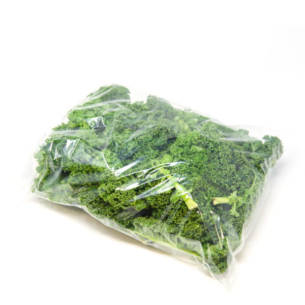 Fresh curly kale in a 0.5 kg bag from Local Market, a nutritious super-food vegetable with vibrant green leaves.
