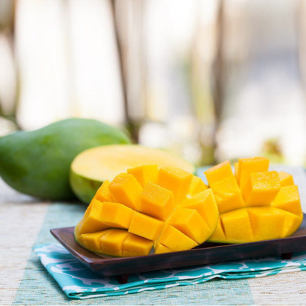 Fresh Keitt mangoes from Local Market in a 3.5 kg carton, showcasing ripe, yellow-green fruit ready to eat.
