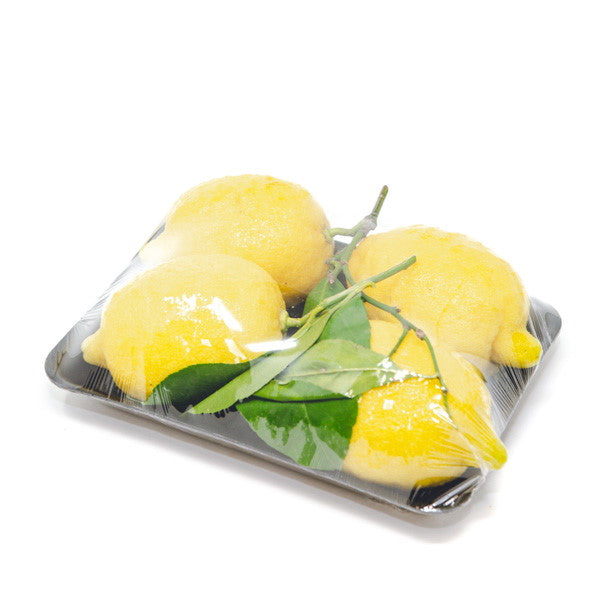 Fresh Amalfi lemons from Holland with leafy stems and thick zest, 1 kg pack of vibrant, ripe citrus fruit.