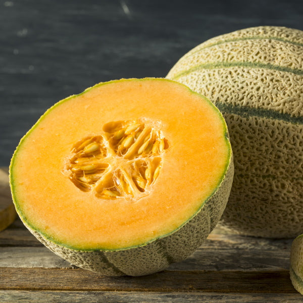 Fresh muskmelon fruit piece from Local Market, showcasing its orange flesh and round shape on a white background.