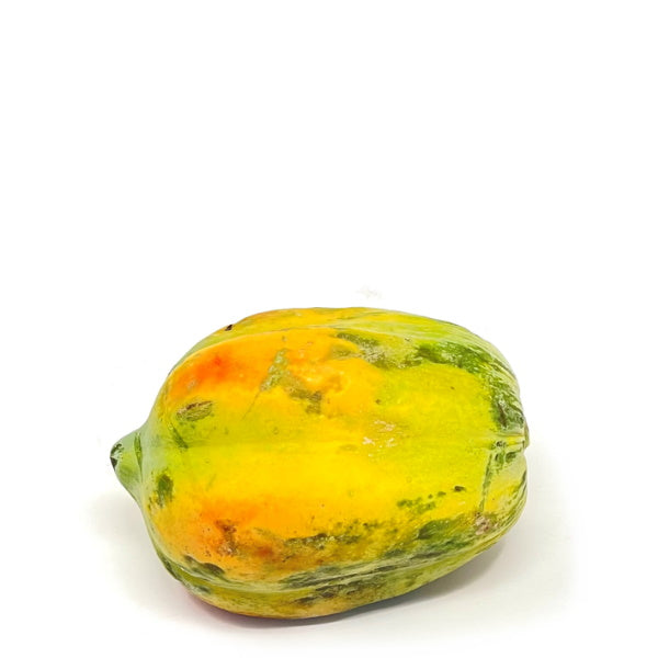Unripe baladi papaya from Local Market, whole fresh fruit with green skin, ready for ripening or cooking.