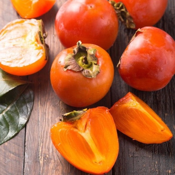 Fresh persimmons from Sharbatly in a 4.5 Kg carton, vibrant orange fruit perfect for snacking or cooking.