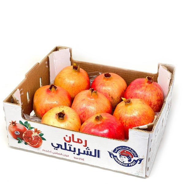 Fresh Wonderful pomegranates in a 3.8 kg carton, vibrant red fruit from Sharbatly, ready for healthy snacking or cooking.