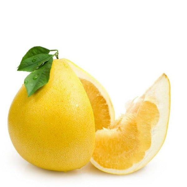 Fresh Sharbatly pomelo fruit with thick yellow rind and juicy pink flesh, shown whole in a natural setting.