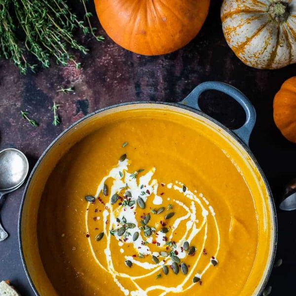 Single Violina squash pumpkin, fresh organic vegetable from Local Market with orange skin and green stem.