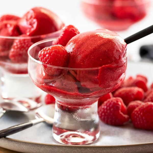 Fresh Sharbatly raspberries in a 0.125 kg pack, showcasing bright red, ripe berries suitable for snacking or recipes.