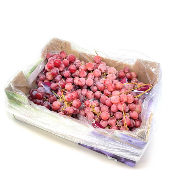 Red Globe grapes in a 4 kg carton, fresh and ripe fruit from Sharbatly, shown in a clear box.