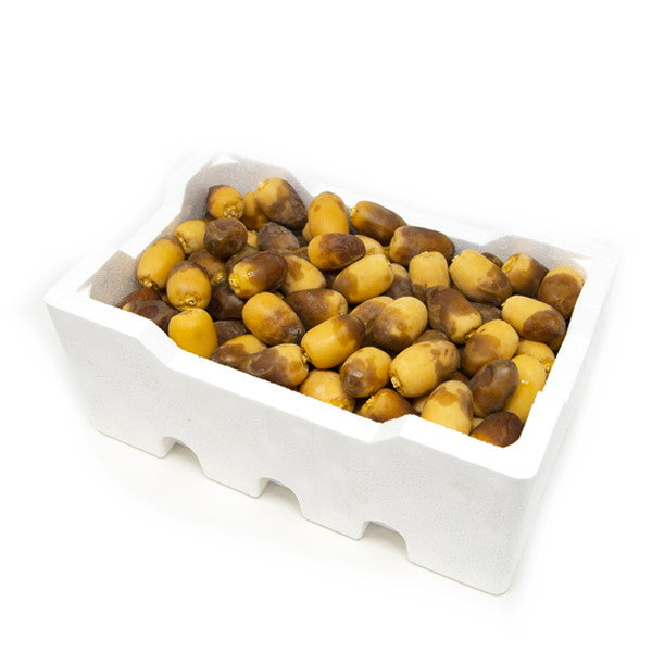 Fresh Sharbatly Rotana dates in a 1.8 kg carton, showcasing plump, glossy dates with smooth skin.