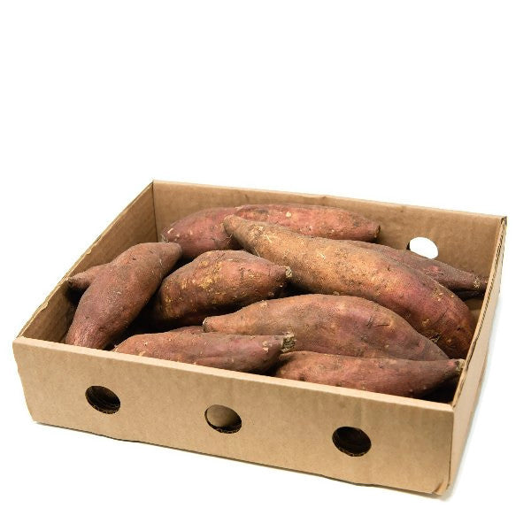 Fresh sweet potatoes from Local Market in a 3 kg carton, showcasing the orange skin and earthy texture of the vegetables.