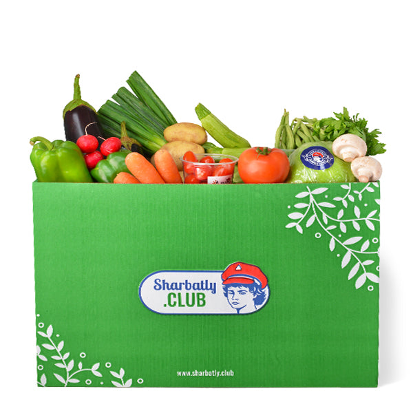 Assorted fresh vegetables in a carton from Mixed brand, including carrots, broccoli, and bell peppers, arranged in a veg box.