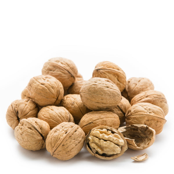 Raw walnuts from Sharbatly in a 0.5 kg pack, showing whole, shelled walnuts with natural brown shells and textured surface.