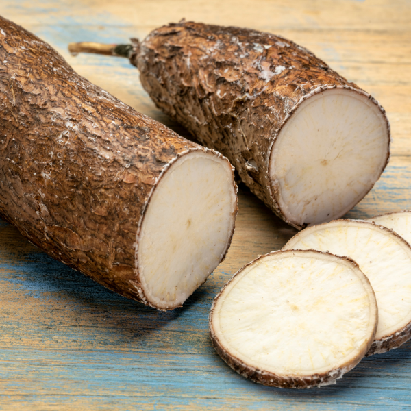 Fresh 2kg pack of tapioca, yuca, and cassava vegetable from Local Market, showing whole roots on a clean surface.