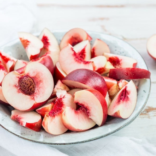 Fresh white nectarines in a 1 kg pack from Local Market, showcasing ripe, juicy fruit with smooth skin.