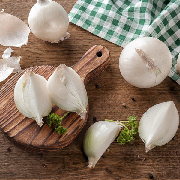 White onions in a 2kg bag from Local Market, fresh vegetable with smooth white skins and firm texture, ready for cooking.